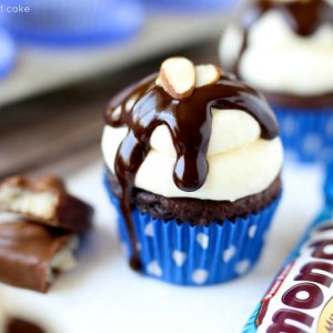 Almond Joy Cupcakes dripping in chocolate