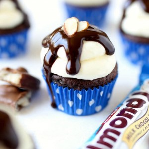 Almond Joy Cupcakes dripping in chocolate