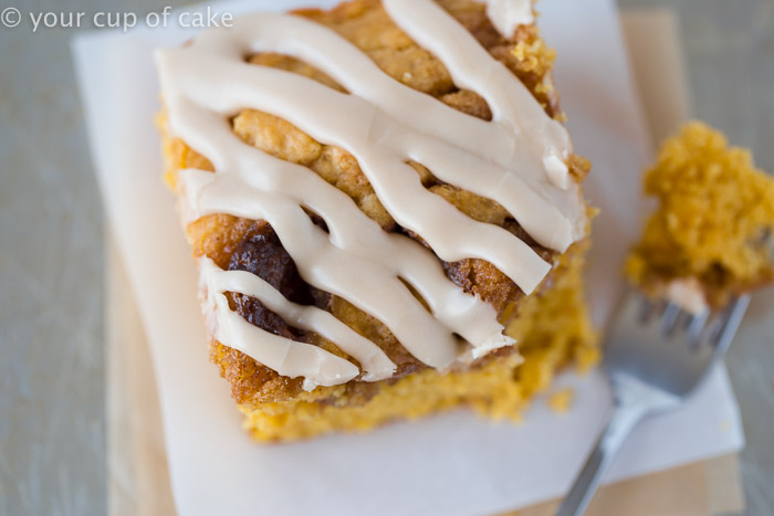 This Pumpkin Cinnamon Roll Cake is the most amazing cake ever! Serve it warm with the maple glaze! 