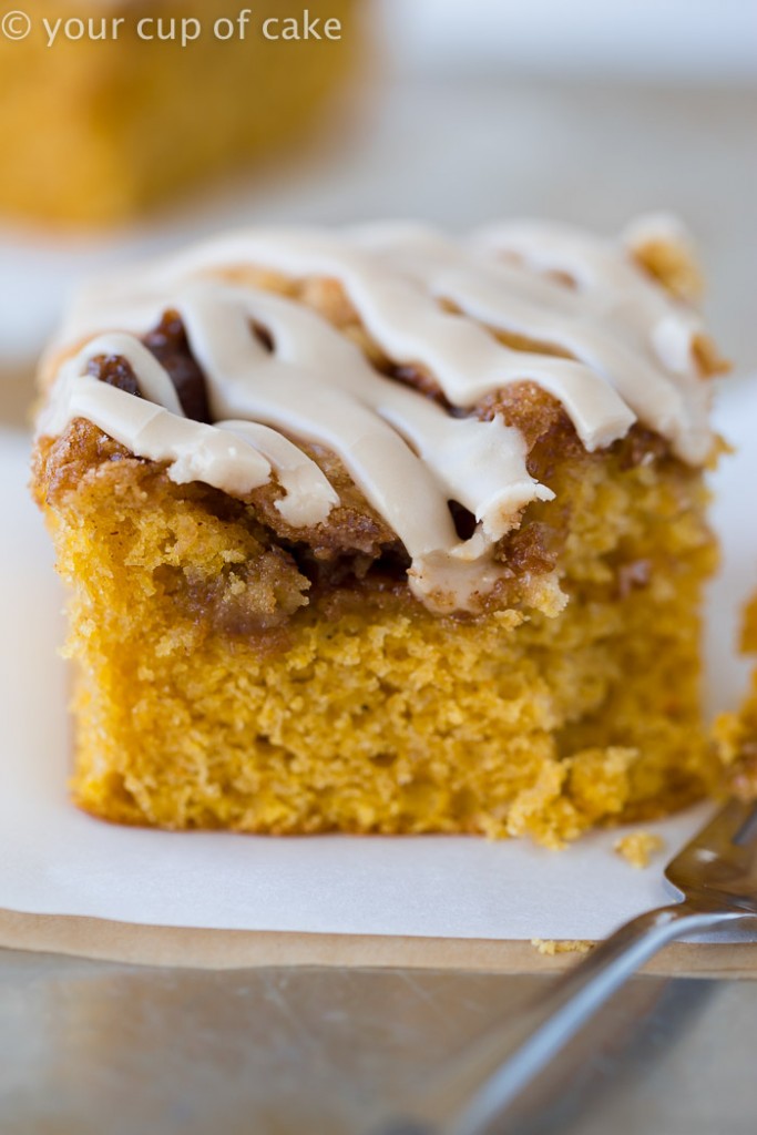 This Pumpkin Cinnamon Roll Cake is the most amazing cake ever! Serve it warm with the maple glaze! 