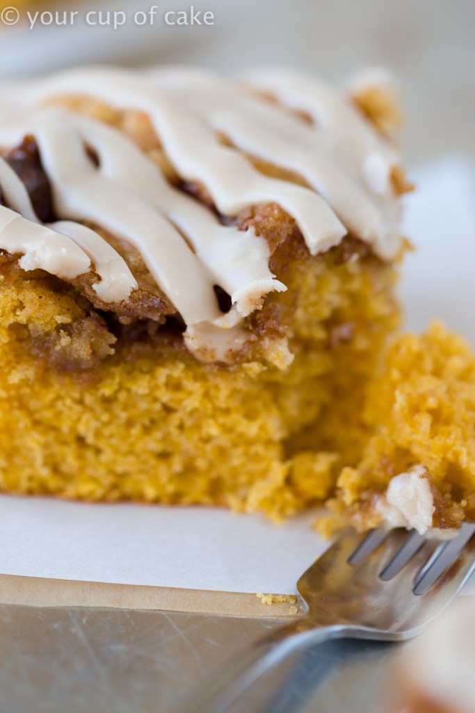 This Pumpkin Cinnamon Roll Cake is the most amazing cake ever! Serve it warm with the maple glaze! 