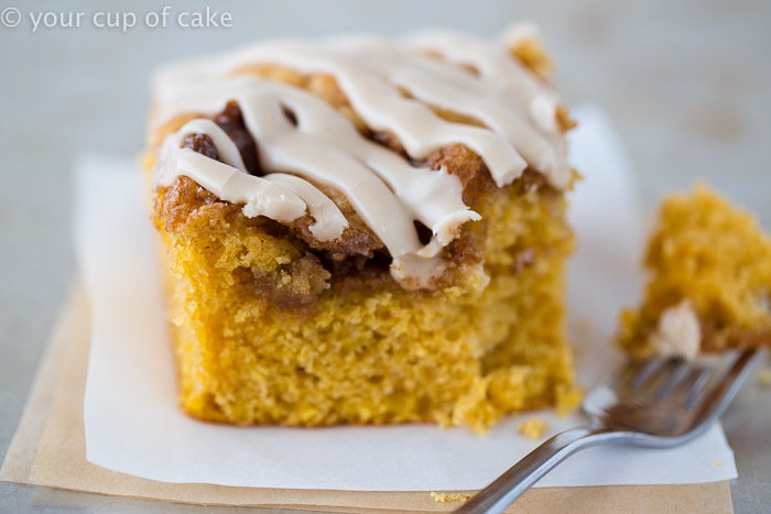 This Pumpkin Cinnamon Roll Cake is the most amazing cake ever! Serve it warm with the maple glaze! 