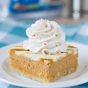 Pumpkin Pie Bars with a Cream Cheese Swirl and a no fuss crust! So easy and perfect for Thanksgiving!