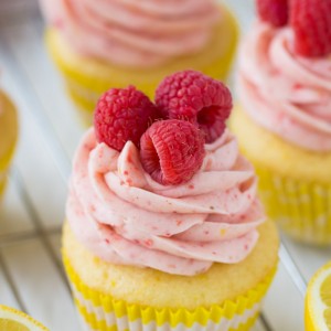 Raspberry Lemonade Cupcakes with a scratch and cake mix recipe! The raspberry frosting is to die for!