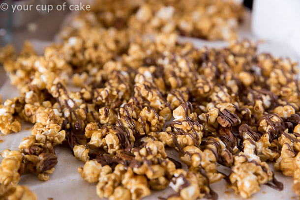 Turtle Caramel Corn with pecans and drizzled with milk chocolate! 