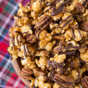 Turtle Caramel Corn with pecans and drizzled with milk chocolate!
