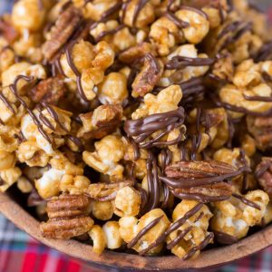 Turtle Caramel Corn with pecans and drizzled with milk chocolate!