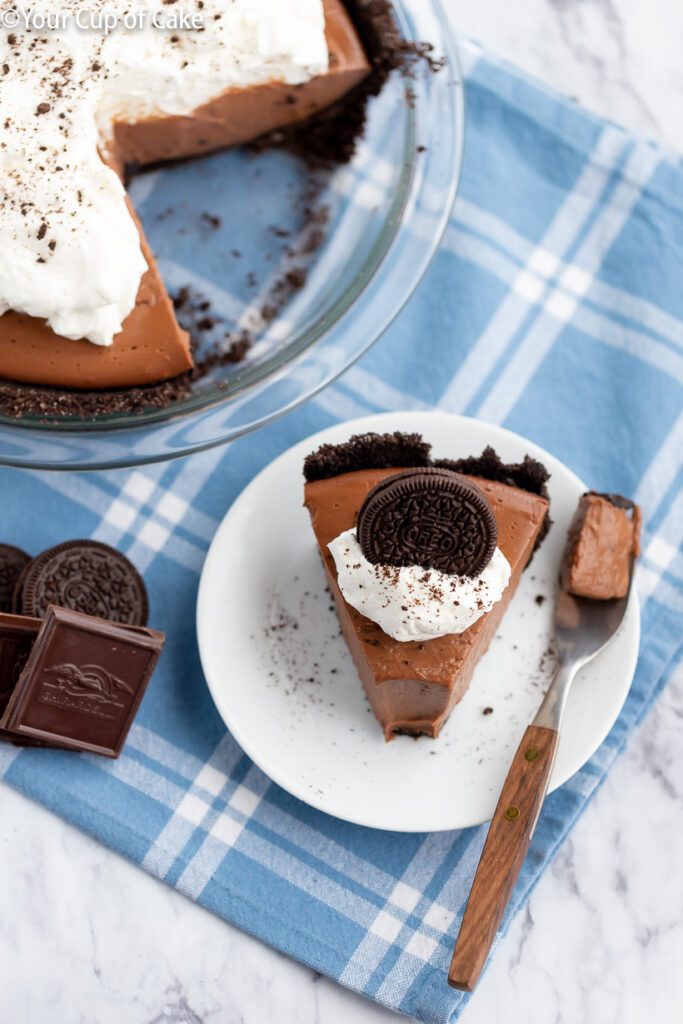 Chocolate Cream Pie with Oreo Crust and whipped cream that won't melt because of a secret ingredient!